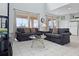 The open-concept living room features neutral wall paint and coordinating furniture at 321 Rosso Dr, Davenport, FL 33837