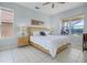 Comfortable main bedroom with large windows, tiled floor, and stylish wooden furniture at 321 Rosso Dr, Davenport, FL 33837
