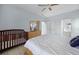 Spacious main bedroom with crib, ensuite bathroom, and walk-in closet at 321 Rosso Dr, Davenport, FL 33837