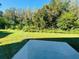 Expansive backyard with lush lawn and mature trees at 3370 Cypress Point Cir, St Cloud, FL 34772