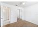 Bright bedroom featuring plush carpeting, a ceiling fan, and a mirrored closet at 3370 Cypress Point Cir, St Cloud, FL 34772