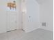 Bright entry foyer with white tile flooring, high ceilings, and a decorative pendant light at 3370 Cypress Point Cir, St Cloud, FL 34772