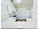 Bright kitchen featuring white cabinets, stainless steel sink, and appliances at 3370 Cypress Point Cir, St Cloud, FL 34772