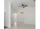 Open living area featuring tile flooring, high ceilings, and neutral-toned walls at 3370 Cypress Point Cir, St Cloud, FL 34772