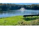 Community pond featuring a fountain and bench overlooking the water at 3370 Cypress Point Cir, St Cloud, FL 34772
