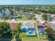 Aerial view showcasing the house with screened pool, lush landscaping and a great neighborhood setting at 3893 Blackberry Cir, St Cloud, FL 34769
