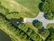Aerial view of community boat ramp on the canal with lush foliage and boat launch area at 3893 Blackberry Cir, St Cloud, FL 34769