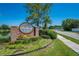 Blackberry Creek community sign, beautifully landscaped, with pond and a glimpse of neighborhood at 3893 Blackberry Cir, St Cloud, FL 34769