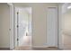 Hallway view showcasing the layout with a bathroom doorway visible on the left and bedroom doorway on the right at 3893 Blackberry Cir, St Cloud, FL 34769