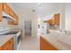Kitchen with stainless steel appliances and views of the dining room at 3893 Blackberry Cir, St Cloud, FL 34769