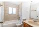 Updated bathroom with tiled walls, a shower-tub combo, and a neutral-toned vanity at 408 Sandpiper Ridge Dr, Orlando, FL 32835