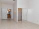Spacious bedroom with tile floors, closet, and entry to a bathroom at 408 Sandpiper Ridge Dr, Orlando, FL 32835