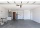 Spacious two-car garage with white block walls, a side door, and ample room for vehicles and storage at 408 Sandpiper Ridge Dr, Orlando, FL 32835