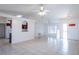 Bright, open living room with tile floors, high ceilings, and access to kitchen and front entry at 408 Sandpiper Ridge Dr, Orlando, FL 32835