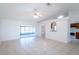 Bright living room featuring tile floors, a ceiling fan, and sliding glass doors to a screened-in patio at 408 Sandpiper Ridge Dr, Orlando, FL 32835