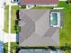 Aerial view of a home's roof and fenced-in pool, demonstrating its layout and outdoor amenities at 426 Prestwick Dr, Davenport, FL 33897