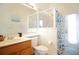 Clean bathroom with a single sink vanity and shower featuring a curtain with a nautical theme at 426 Prestwick Dr, Davenport, FL 33897