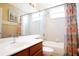 Bright bathroom featuring a tub and shower combo with a single sink vanity at 426 Prestwick Dr, Davenport, FL 33897