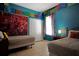 Bright bedroom with two beds, colorful decorations and natural light from a window at 426 Prestwick Dr, Davenport, FL 33897