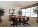 Inviting dining room featuring a game table, neutral decor, and a large window for natural lighting at 426 Prestwick Dr, Davenport, FL 33897