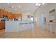 Spacious open kitchen with a center island, bar stool seating, and easy access to the dining and living areas at 426 Prestwick Dr, Davenport, FL 33897