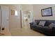 Comfortable living room featuring a gray couch, neutral walls, and tile flooring at 426 Prestwick Dr, Davenport, FL 33897