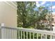 Balcony view overlooking lush green space with mature trees and manicured lawns at 438 Water St # 438, Celebration, FL 34747