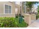 Attractive exterior of a well-maintained building with lush green landscaping, and a street sign showcasing the community's name at 438 Water St # 438, Celebration, FL 34747
