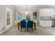 Bright dining room with stylish chairs, modern light fixture and decor at 438 Water St # 438, Celebration, FL 34747