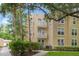 Lovely three-story condo building featuring private balconies and well-maintained landscaping at 438 Water St # 438, Celebration, FL 34747