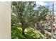 Elevated view shows lush green space and a side of an adjacent home at 438 Water St # 438, Celebration, FL 34747