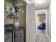 Laundry area features newer appliances and opens to the hall with views to the bedroom at 438 Water St # 438, Celebration, FL 34747