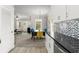 View from kitchen to a spacious living room with plush furniture and natural light at 438 Water St # 438, Celebration, FL 34747