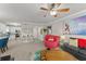 Comfortable living room featuring a ceiling fan, and a variety of colorful decor at 438 Water St # 438, Celebration, FL 34747