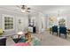 Open living area with dining set, bright windows and neutral walls at 438 Water St # 438, Celebration, FL 34747