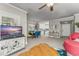 Bright living room featuring an entertainment center, plush furniture, and a dining space at 438 Water St # 438, Celebration, FL 34747