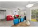 Spacious living room with dining area, plush furniture, and natural light at 438 Water St # 438, Celebration, FL 34747