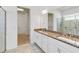 Bathroom vanity with granite countertops and double sinks at 5009 E Fountainwood Dr, St Cloud, FL 34772