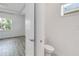 Attached bathroom with a toilet and window, visible from the bedroom at 5009 E Fountainwood Dr, St Cloud, FL 34772