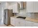 Gourmet kitchen with granite counters, stainless steel appliances, and tile backsplash at 5009 E Fountainwood Dr, St Cloud, FL 34772