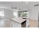Open floor plan showing the kitchen island, granite counters and adjoining living space at 5009 E Fountainwood Dr, St Cloud, FL 34772