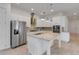 Modern kitchen with a spacious island and stainless steel appliances at 5009 E Fountainwood Dr, St Cloud, FL 34772