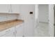 Laundry room features granite countertops, white cabinets, and stainless appliances; includes laundry room view at 5009 E Fountainwood Dr, St Cloud, FL 34772