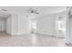 Spacious living room with tile floors, lots of natural light, and a ceiling fan at 5009 E Fountainwood Dr, St Cloud, FL 34772
