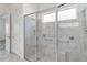 Modern glass shower with gray tile and built in storage at 5009 E Fountainwood Dr, St Cloud, FL 34772