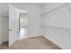 A roomy walk-in closet offers metal shelving for storage and a view into the adjoining room at 5009 E Fountainwood Dr, St Cloud, FL 34772