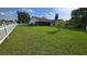 Beautifully maintained backyard with lush grass and surrounding trees at 501 Kilimanjaro Dr, Kissimmee, FL 34758