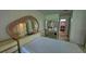 Spacious bedroom with unique mirror and cabinetry at 501 Kilimanjaro Dr, Kissimmee, FL 34758