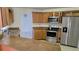 Bright kitchen features granite counters, stainless steel appliances, and ample cabinetry at 501 Kilimanjaro Dr, Kissimmee, FL 34758