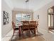 Formal dining room with large window and elegant light fixture, perfect for Gathering gatherings at 518 Brighton Dr, Davenport, FL 33897